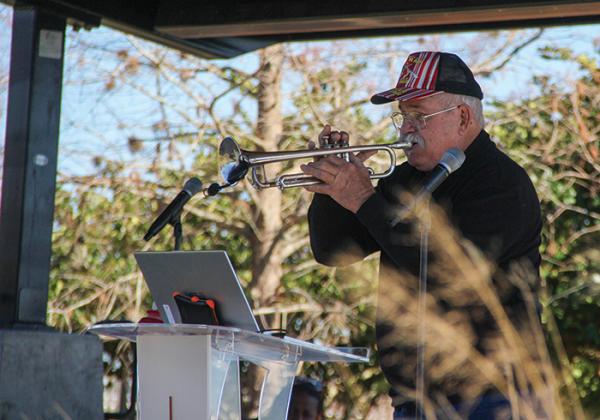 Local musician Buffalo Munn plays the trumpet during the Martin Luther King Jr. Day Festival at the Palatka riverfront.