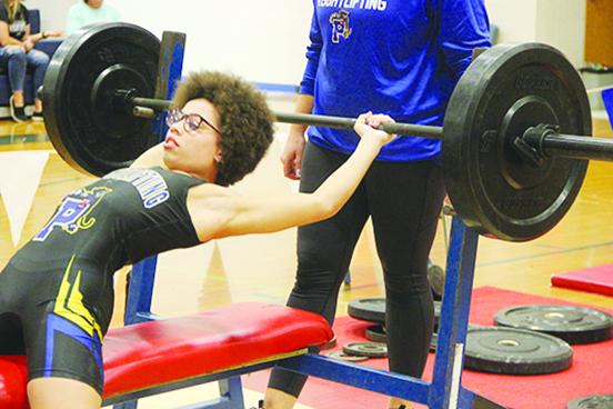Palatka’s Mikah Harvey attempts to do the bench press at 119 pounds at the District 8-1A championship at Pierson Taylor High School. Wednesday. (COREY DAVIS / Palatka Daily News)