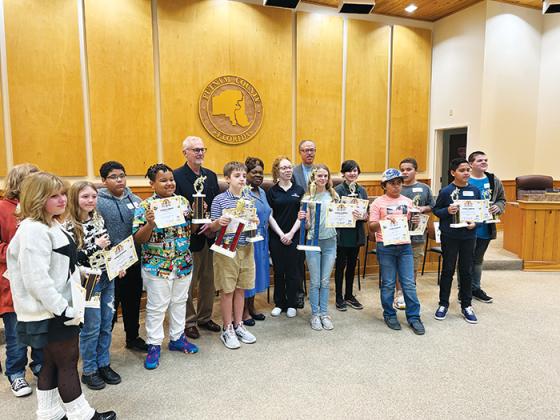 Students in fifth through eighth grades stand together after the 54th Annual Putnam County School District Spelling Bee, which took place Wednesday at the government complex in Palatka.