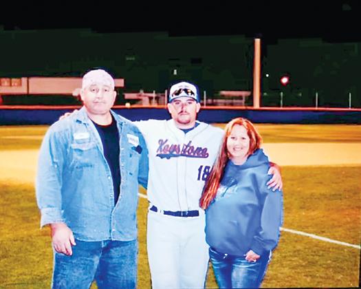 Austin Bass, as a Keystone Heights High School baseball player, stands with his family.
