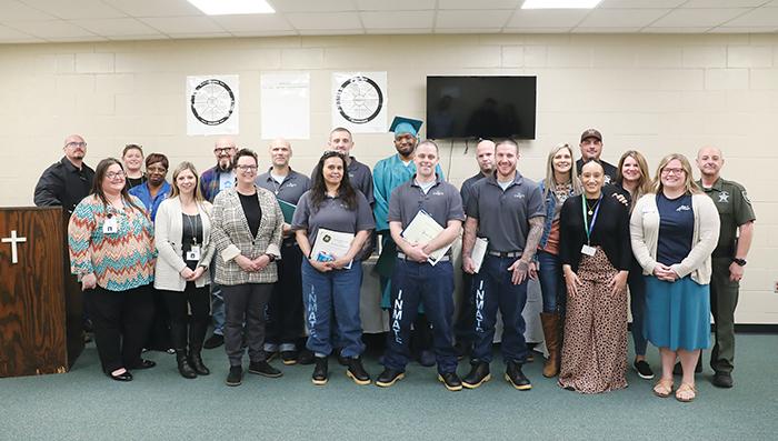 Officials from the Putnam County Sheriff’s Office and partnering organizations stand with Putnam inmates who were celebrated last week for achievements in the Insight recovery program.