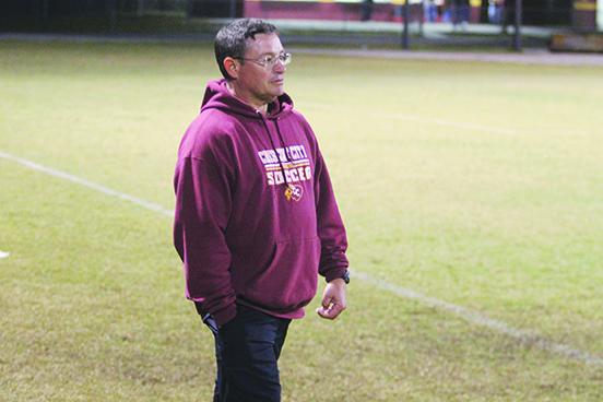 Crescent City boys soccer coach Jeff Lease watches his team during the first half of Tuesday night’s game against Deltona. (MARK BLUMENTHAL / Palatka Daily News)
