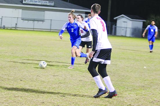 Palatka's Braxton Anderson tries to bring the ball up below Baker County’s Robbie Hill (behind) and Blake Mays. (MARK BLUMENTHAL / Palatka Daily News)
