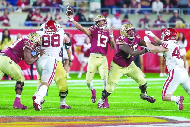Florida State quarterback and game Most Valuable Player Jordan Travis gets redy to throw a pass against the Sooners. (GREG OYSTER / Special to the Daily News)