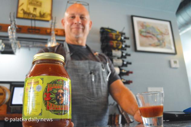 Velchoff’s Corner Bar Manager and Mixologist Remy Rimavicus shows off his own, award-winning,  bloody mary mix called Remy’s Bloody Mary Experience at the recently opened oyster bar Friday afternoon. (CASMIRA HARRISON/Palatka Daily News)