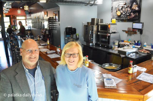 Husband and wife team Richard and Donna Feibelman are seen inside their recently opened Velchoff’s Corner Oyster Bar, just off  2nd Street in Downtown Palatka on Friday. The duo are excited about the new bar, inside dining area and plans for the future. (CASMIRA HARRISON/Palatka Daily News)