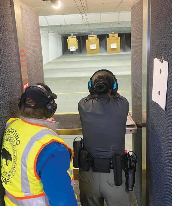 A sheriff’s office Explorer practices firearm training during a conference in Tennessee.