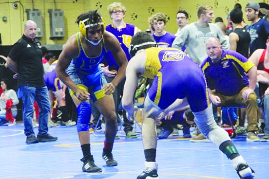 Palatka’s Ishmael Foster (left) competes in a District 4-1A 132-pound bout. (COREY DAVIS / Palatka Daily News)