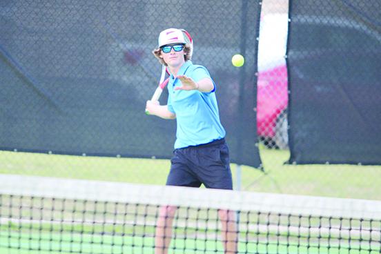 Palatka's Wyatt Blevins delivers a shot in his first doubles victory over Bradford with partner Cullen Sloan. (MARK BLUMENTHAL / Palatka Daily News)