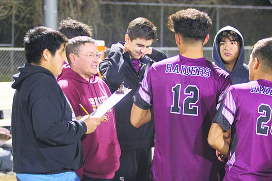 Crescent City boys soccer coach Jeff Lease (second, left) and his Raiders advanced to the Region 3-3A semifinals after defeating Melbourne West Shore, 3-1, Wednesday night. (MARK BLUMENTHAL / Palatka Daily News)