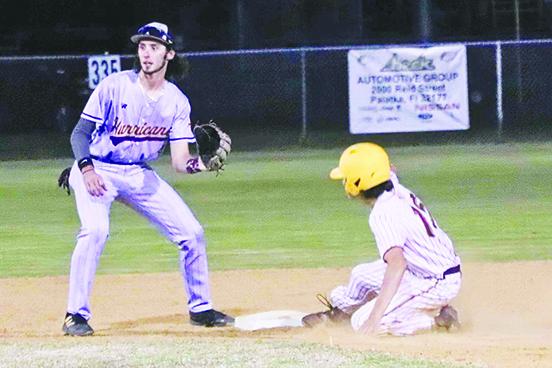 Crescent City’s Cayde Morris slides safely into second base as Lake Weir shortstop Garrett Payne awaits the throw. (RITA FULLERTON / Special to the Daily News)