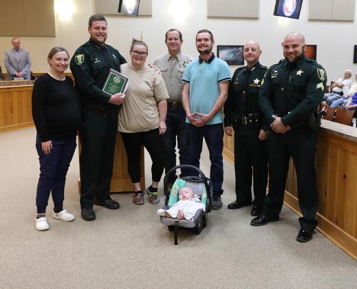 Calvin Miller's family honors Deputy Hunter Jones on Tuesday with a plaque to express their gratitude. 