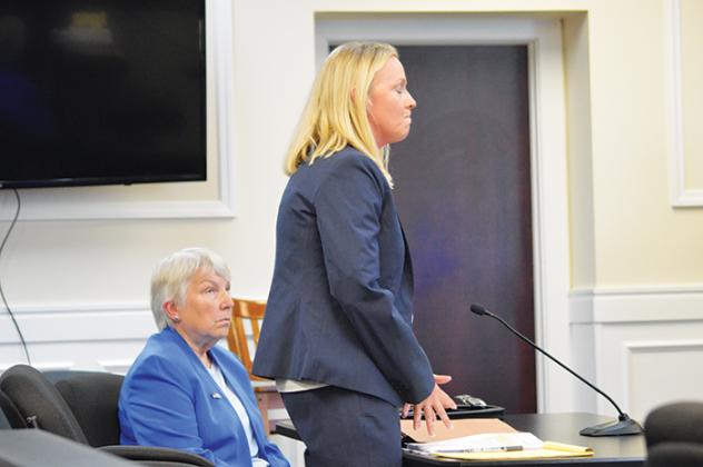 Crescent City Commissioner Cynthia Burton, left, listens to her attorney, Meagan Logan, at the Putnam County Courthouse on Thursday.