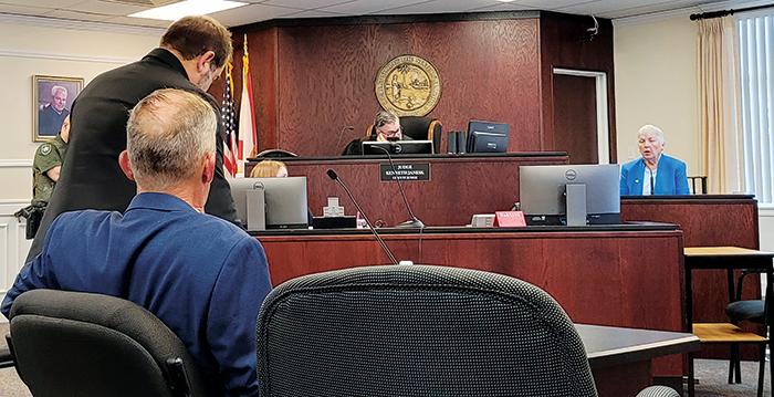 Crescent City Commissioner Cynthia Burton, right, responds to questions from attorney Marc Randazza, standing at left, at a hearing Thursday at the Putnam County Courthouse.