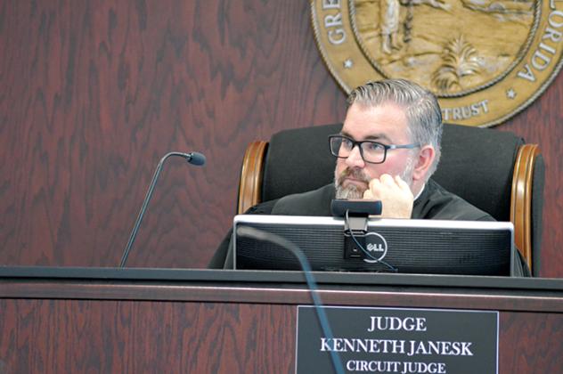 Circuit Judge Kenneth Janesk listens to attorney arguments during a hearing at the courthouse regarding a petition effort to recall Burton.