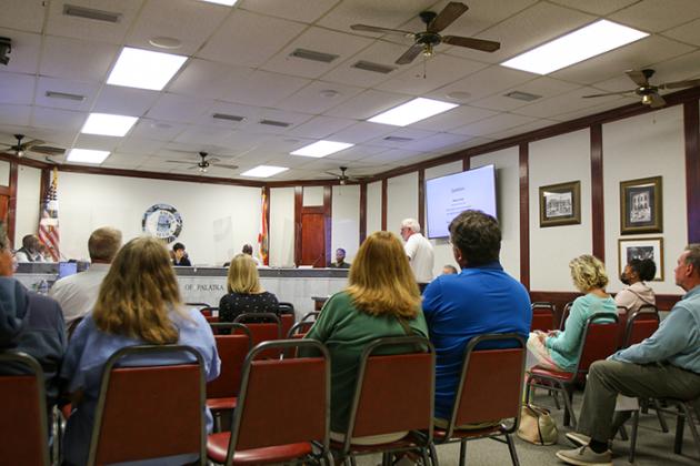 Palatka Community Redevelopment Agency members listen to a presentation Monday about the Florida Main Street program.