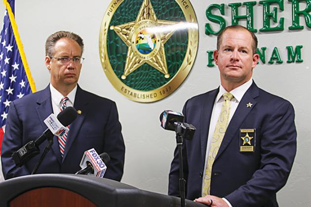 State Attorney Mark Johnson, left, and Sheriff Gator DeLoach answer questions from the media Tuesday during a press conference in Palatka