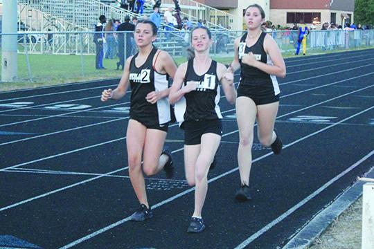 Interlachen’s Paislee Guessford, Myah Vinson and Erin Jacobsen have been strong competitors in the 3,200 this season. (MARK BLUMENTHAL / Palatka Daily News)