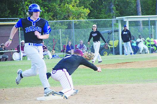 Interlachen’s Landon McCollum is out on a close play in the third inning of Thursday’s game as Crescent City first baseman Helmut Waters collects the ball. (COREY DAVIS / Palatka Daily News)