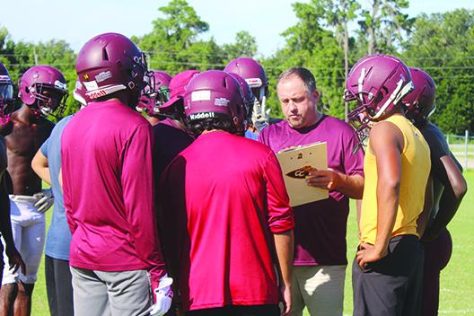 Sean Delaney goes over a play with his Crescent City Junior-Senior High football players during a practice session on Aug. 15 2022. Delaney went 11-19 in his three years in charge of the program. (MARK BLUMENTHAL / Palatka Daily News)