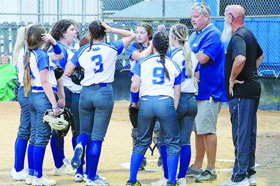 Currently, the Peniel Baptist Academy softball team of head coach Jeff Hutchins (second, right) are in the sixth spot in the Region 1-2A tournament rankings. (RITA FULLERTON / Special to the Daily News)