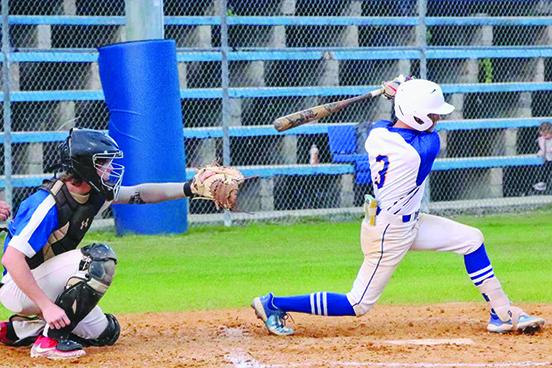 Palatka’s Tanner Ortiz takes a swing at a pitch against Keystone Heights as catcher Andrew Wilson awaits the pitcher. (RITA FULLERTON / Special to the Daily News)