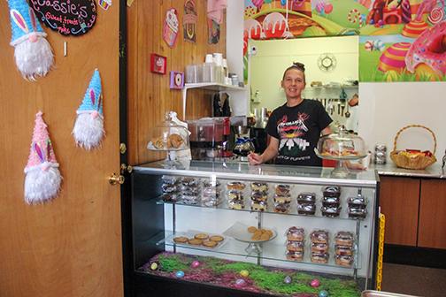 SARAH CAVACINI/Palatka Daily News. Cassie Harrig smiles behind her baked goods counter at Sassie Cassie's Sweet Treats & More on Thursday. 
