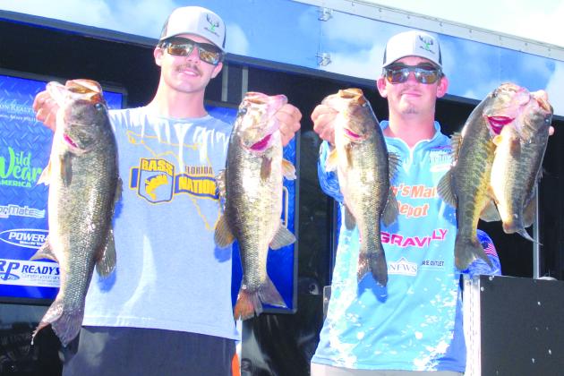 Austin Peters (left) and Syler Prince of Palatka show off some of their catches over the weekend at the Palatka City Dock. The pair were high points leaders for the year in the BASS Nation Juniors/High School Anglers. (GREG WALKER / Daily News correspondent)