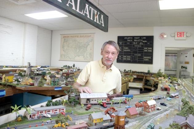 Howard Blasczyk, vice president and treasurer of the Palatka Railroad Preservation Society, shows the Rails of Palatka display that depicts areas around Palatka in the 20th Century. – TRISHA MURPHY/Palatka Daily News 