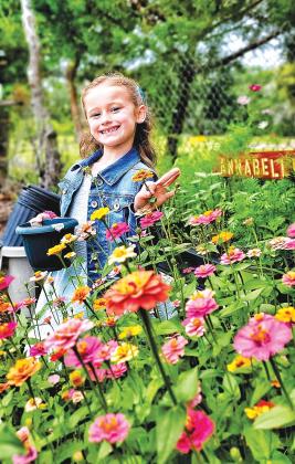 Annabelle Price, 6, seen here in her garden in Palatka, has developed a love for gardening.