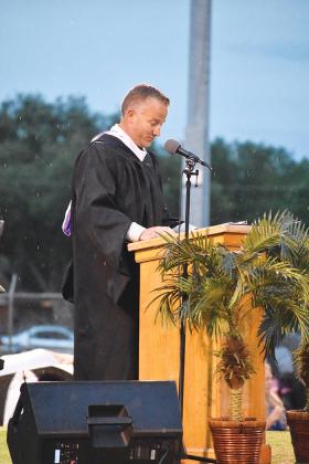 Former Interlachen High Principal Bryan Helms addresses graduating seniors during the ceremony.