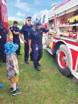 Nathan Scott, 6, gets a tour of a fire truck last week during his visit to Station 7 at Mary Wisham Park in Interlachen.