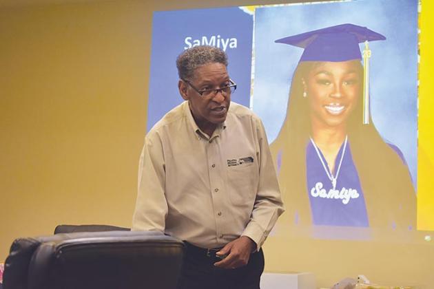 Aaron Robinson, the Palatka Housing Authority's director of resident services, congratulates the agency's residents who are graduating from Palatka Junior-Senior High School.
