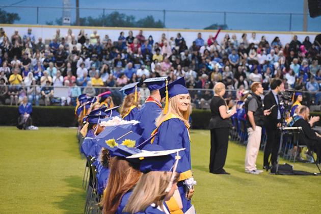 BRANDON D. OLIVER/Palatka Daily News  A Palatka High graduate looks into the crowd to find her loved ones during the graduation ceremony Friday evening.