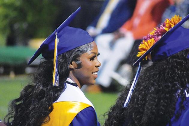 BRANDON D. OLIVER/Palatka Daily News  A Palatka Junior-Senior High School graduate listens to one of the speakers at the school's graduation ceremony Friday.