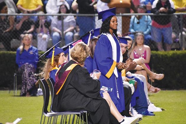 BRANDON D. OLIVER/Palatka Daily News  A Palatka Junior-Senior High School stands to be recognized as a Portrait of a Graduate recipient during the commencement service.