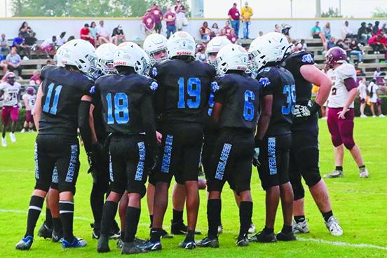 Interlachen football players huddle up during a break in their matchup with Crescent City Friday night in Palatka. (RITA FULLERTON / Special to the Daily News)
