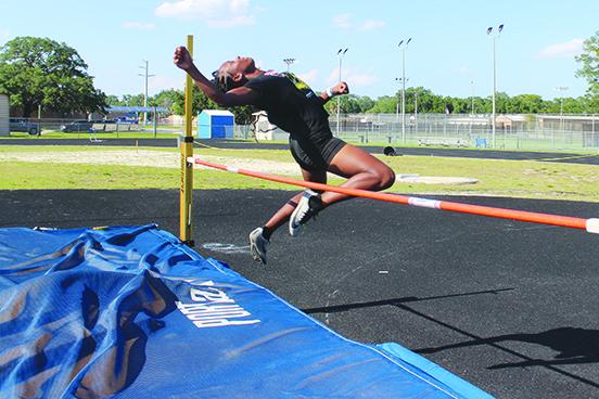 Palatka's Destiny Williams practices in the high jump during Tuesday's practice. (MARK BLUMENTHAL / Palatka Daily News)