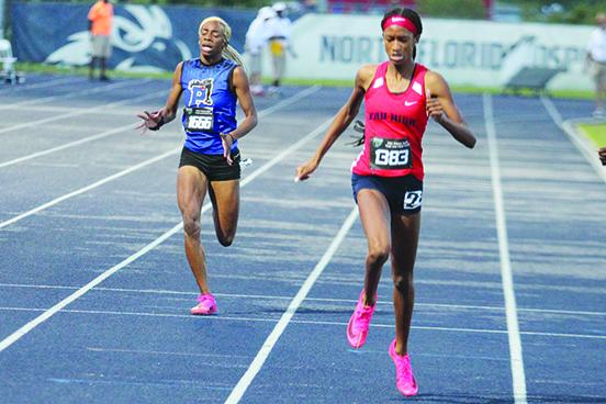 Palatka’s Jahzara Fields (at left) comes across the finish line after finishing the 400-meter dash in 57.15 seconds. (MARK BLUMENTHAL / Palatka Daily News)