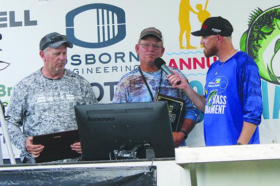 Randy Sievert (left) and fishing partner Danny Inabnett are interviewed by tournament host Brian Stahl after winning the Lads & Lasses Tournament. (MARK BLUMENTHAL / Palatka Daily News)