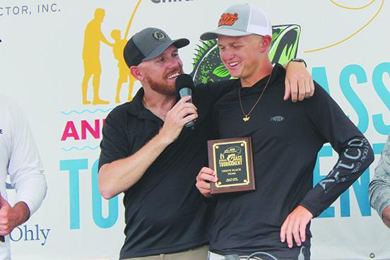 Tenth-place co-finisher Parker Stalvey is interviewed by tournament host Brian Stahl after accepting his award on Saturday, one day after he graduated from Clay High School. (MARK BLUMENTHAL / Palatka Daily News)