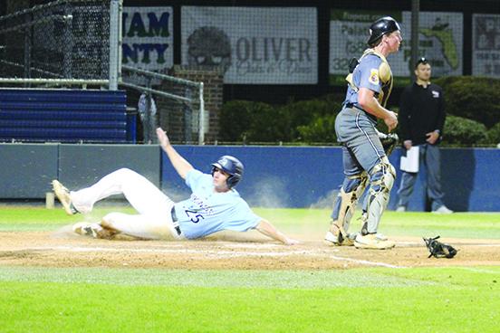 Andon Lewis, here sliding in to score a run in February against Northwest Florida State, has been one of St. Johns River State College’s top hitters this season. (MARK BLUMENTHAL / Palatka Daily News)
