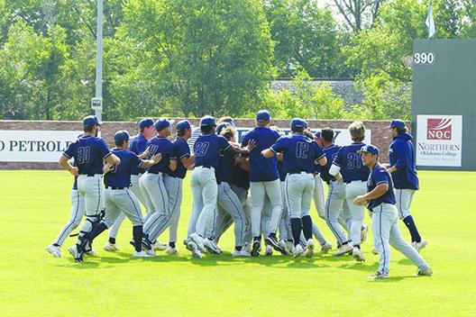 Above, Heartland Community College players celebrate after outlasting St. Johns River State College, 10-9, Friday morning in Enid, Oklahoma. (Samuel Hill / NJCAA World Series pool photo)