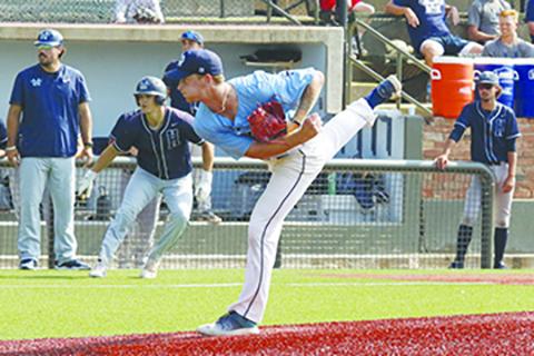 St. Johns River State College pitcher Logan Schmidt throws a pitch during the 10th inning Friday against Heartland Community College. (SAMUEL HILL / NJCAA World Series pool photo)