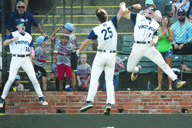 Andon Lewis (25) celebrates scoring a fifth-inning run against Heartland with teammates Jake O’Steen (1) and Cole Steinmetz. (BILLY HEFTON / Enid News and Eagle)