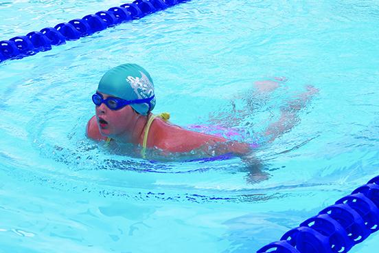 Putnam Sharks swimmer Kyra Vinson competes in the 50-yard breaststroke during Saturday’s opening swim meet at the Putnam Aquatic Center. (MARK BLUMENTHAL / Palatka Daily News)