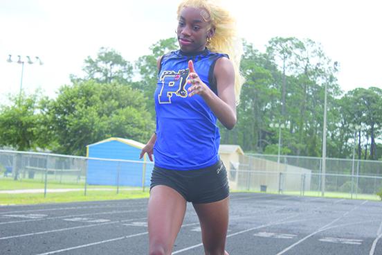 Palatka’s Jahzara Fields made an immediate splash on her home track by winning the District 5-2A meet titles in the 100- and 400-meter dashes. (MARK BLUMENTHAL / Palatka Daily News)