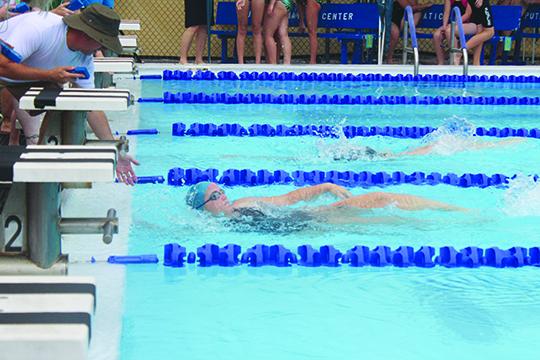 Abby Coulliette swims in to take the girls’ 15-18-year-old division 50-yard backstroke in 34.96 at the Putnam Aquatic Center on Saturday. (MARK BLUMENTHAL / Palatka Daily News)