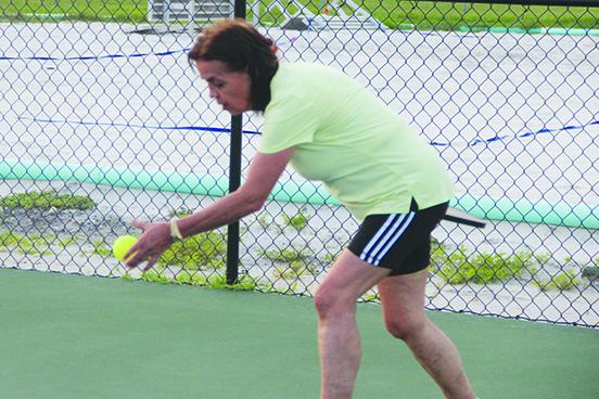Dayana Dejuk gets set to serve the ball during pickleball open play Wednesday at the Theobold Sports Complex. (COREY DAVIS / Palatka Daily News)