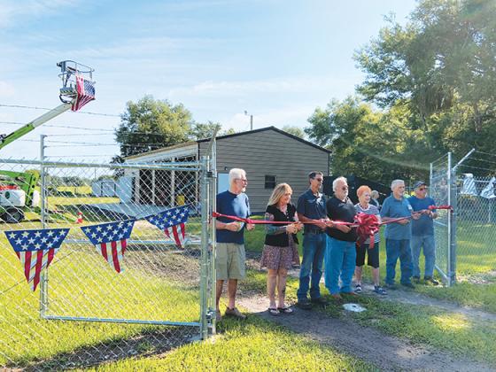 Photo by AL KROMBACH/Special to the Daily News -- Pomona Park officials cut a ribbon on June 24 officially accepting the town’s new maintenance building at Willard Hazen Park.